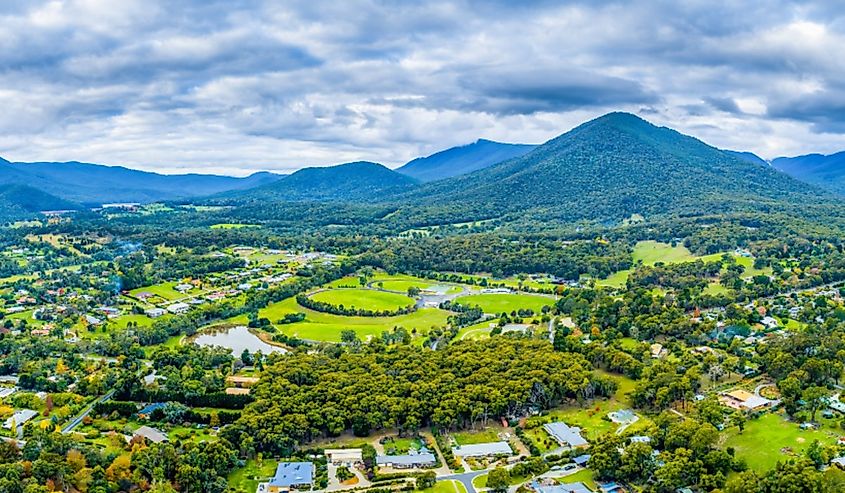 Beautiful aerial panorama of Healesville township and surrounding countryside with forest and mountains in Victoria, Australia.