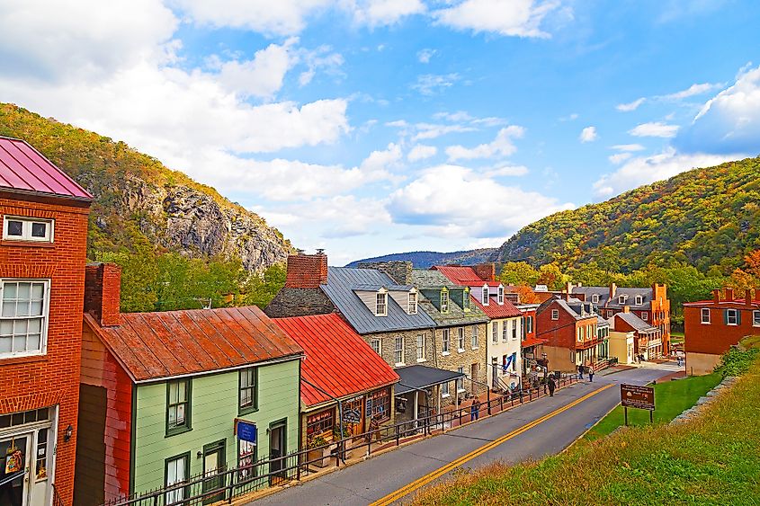 Colorful homes in Harpers Ferry surrounded by gorgeous fall landscape.