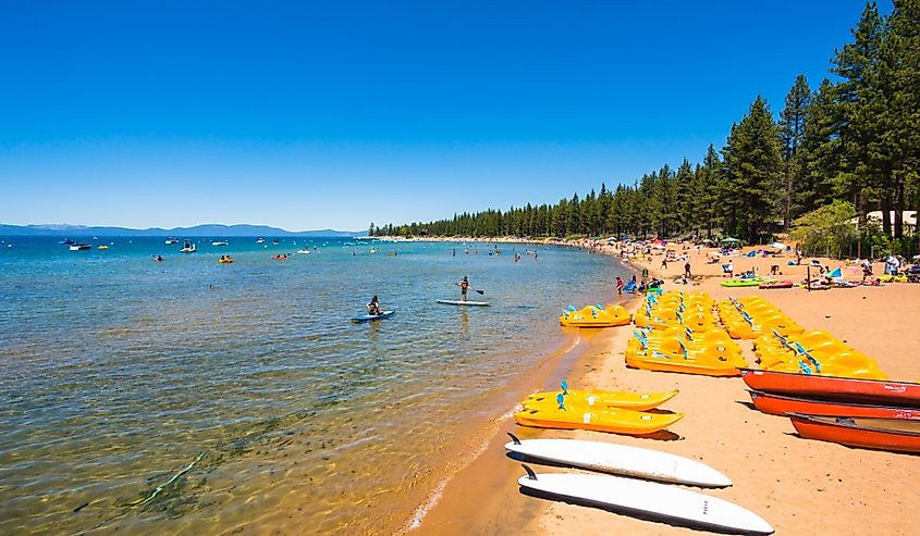 People enjoying the day at the beach in Lake Tahoe, California.
