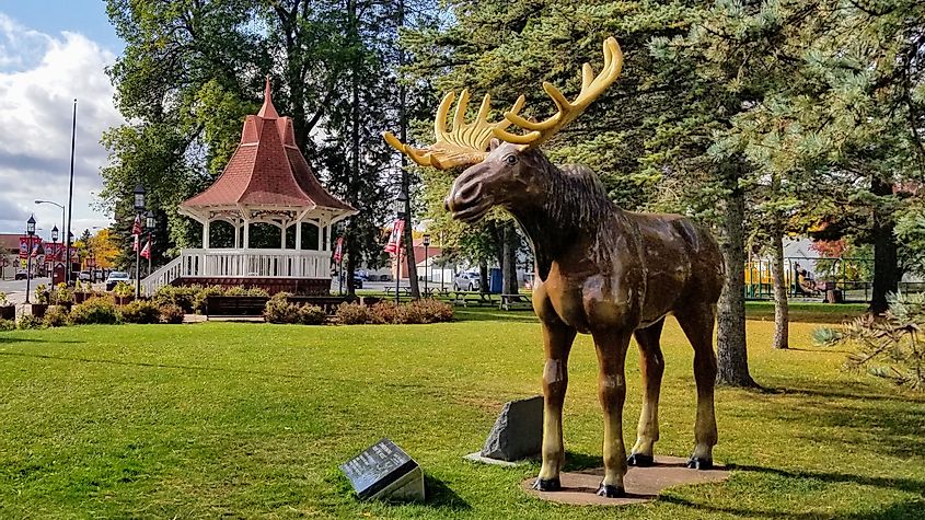 Biwabik, Minnesota park featuring a gazebo and a life-sized statue of a moose.
