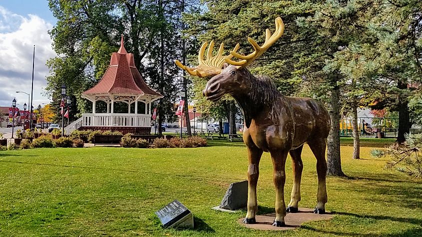 Biwabik, Minnesota park featuring a gazebo and a life-sized statue of a moose. The moose is in honor of children's book Honk, the Moose, based on the real-life story of a moose who visited Biwabik in the winter of 1935.