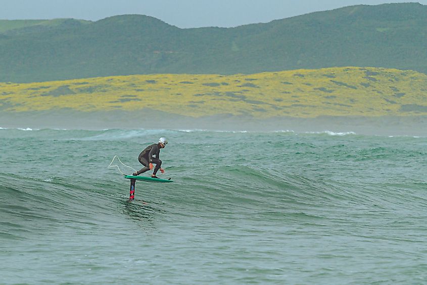 A surfer in Raglan, New Zealand