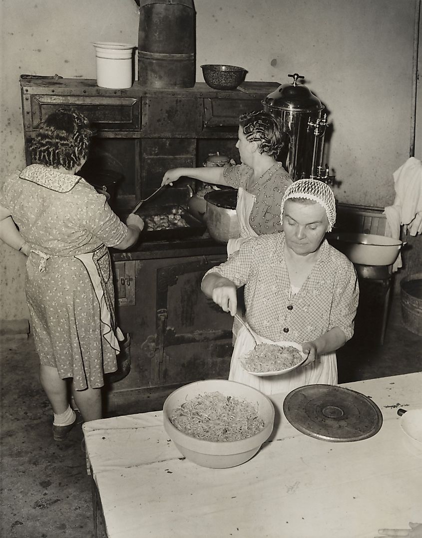 Women cooking spaghetti and frying chicken on an old stove for the Tontitown Grape Festival in Tontitown, Arkansas