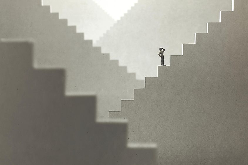 Man lost in a maze of stairs