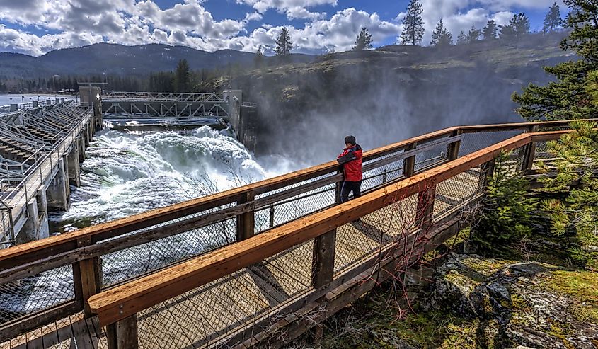 Woman on walkway at the Post Falls Dam in Idaho.