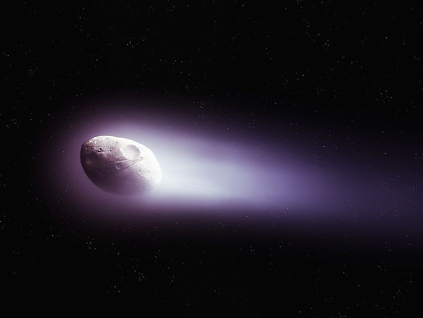 Halley's Comet isolated in space showing the nucleus and tail of a large comet on a black background.