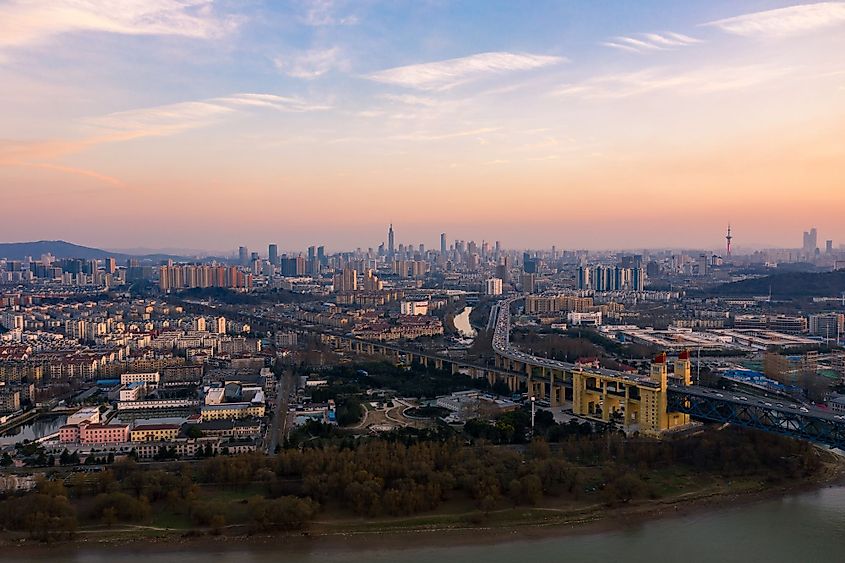 Aerial view of the Nanjing-Yangtze River bridge and the skyline of Nanjing city at sunset. 