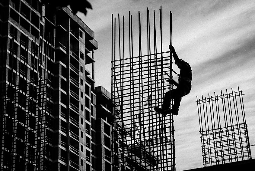 Silhouette of a Man holding on to a Metal Frame (Image Credit: Александр Македонский via Pexels)