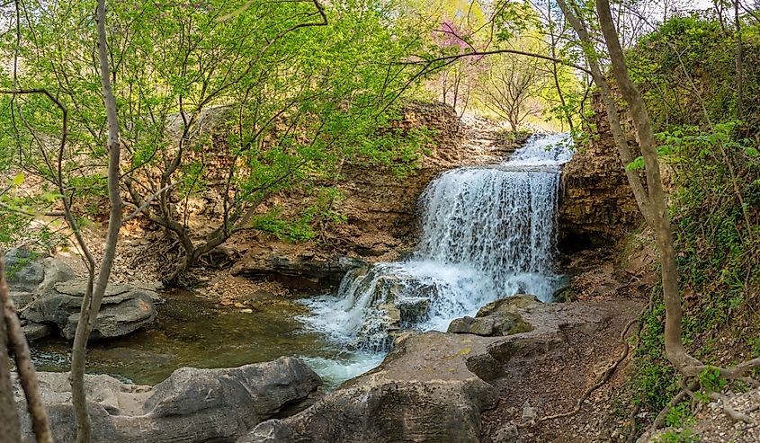 Waterfall at Tanyard Creek Nature Trail, Bella Vista, Arkansas. Image credit shuttersv via Shutterstock.