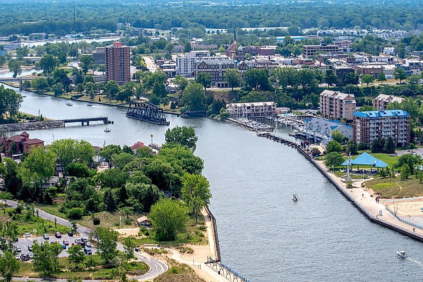 An aerial view from a helicopter over St. Joseph, Michigan, shows the town, St. Joe River, and a thriving city.