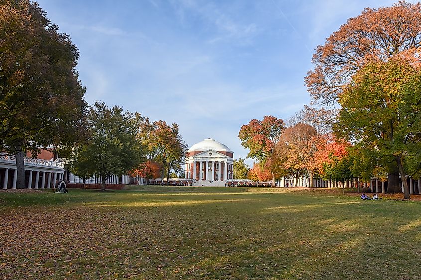 The Rotunda building at the University of Virginia in Charlottesville surrounded by trees showing fall colors.