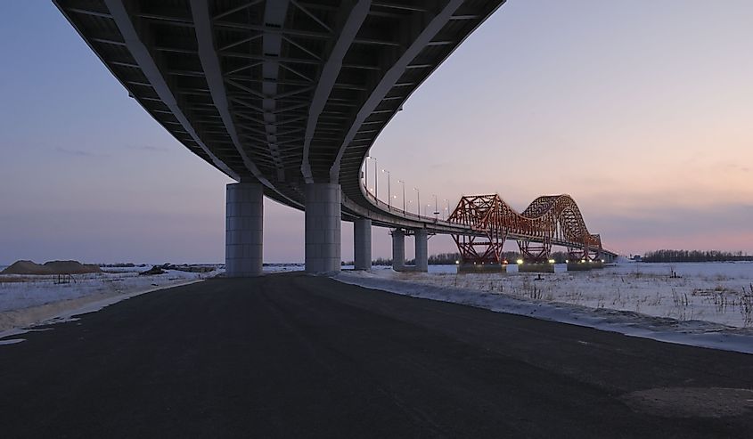 Road Bridge over the Irtysh river in Khanty Mansiysk in the evening. Khanty-Mansiysk. Western Siberia. Russia.