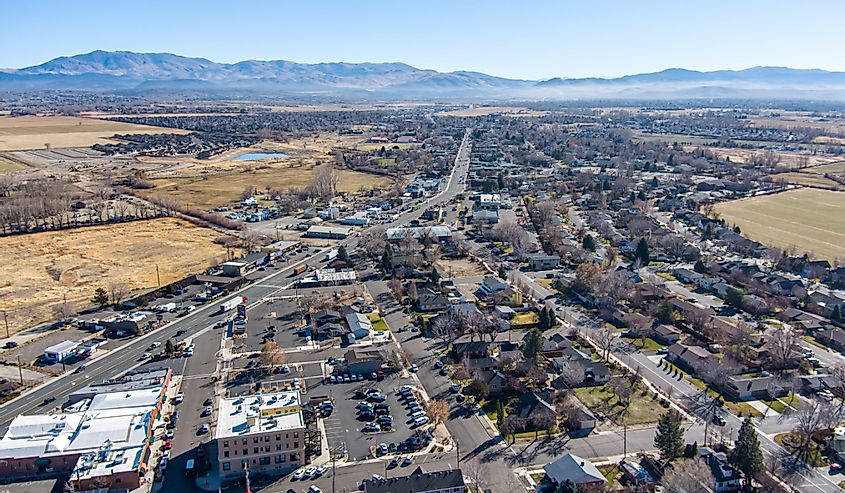 Aerial view of Minden, Nevada. Shows buildings, streets and mountains. 