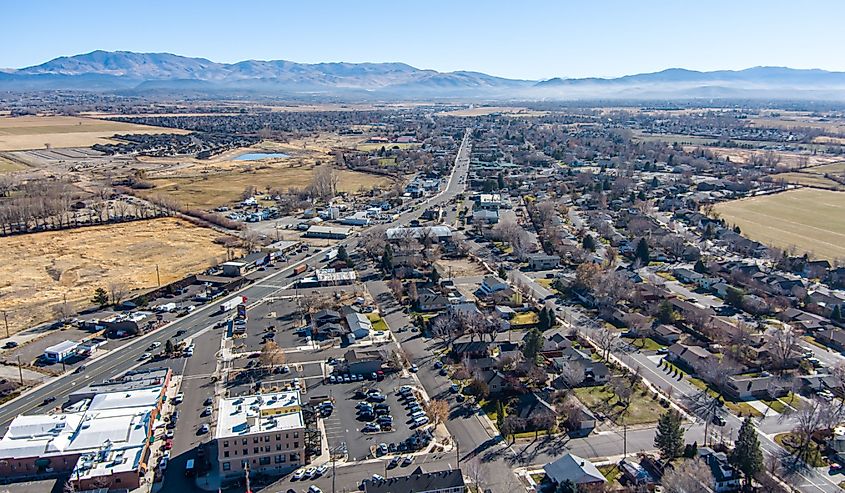 Aerial view of Minden, Nevada. Shows buildings, streets and mountains. 