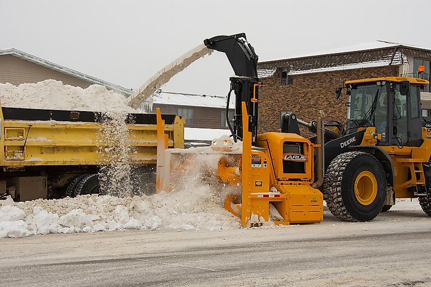 Bismarck, North Dakota: City snow removal equipment working to remove snow from city streets.