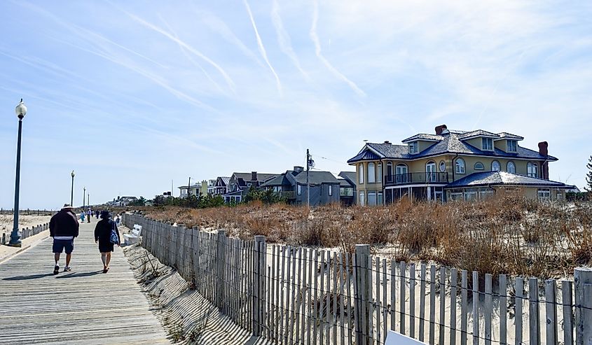 People walking along the boardwalk in Rehoboth Beach, Delaware.