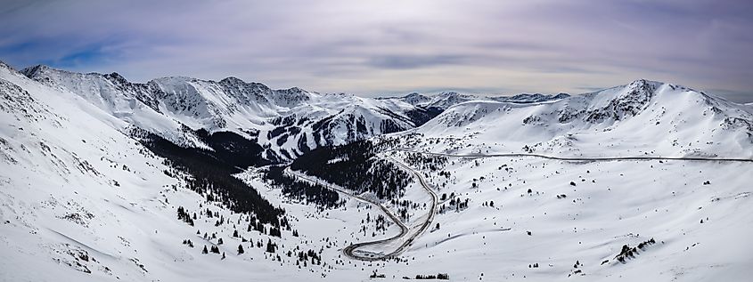 Breathtaking winter snow beauty of Loveland Pass, Colorado. Mountains and winding roads adventure and exploration.