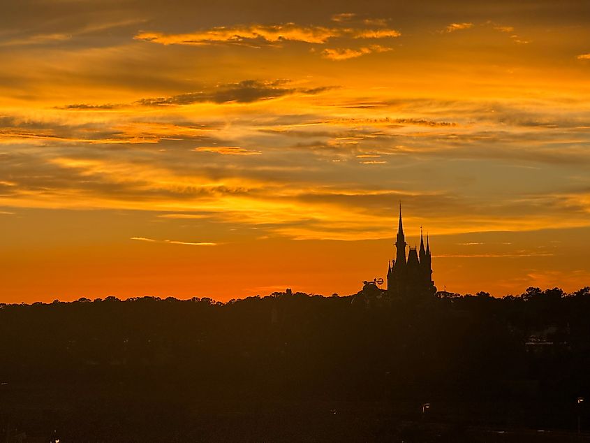 Cinderella Castle at Walt Disney World silhouetted at sunset.