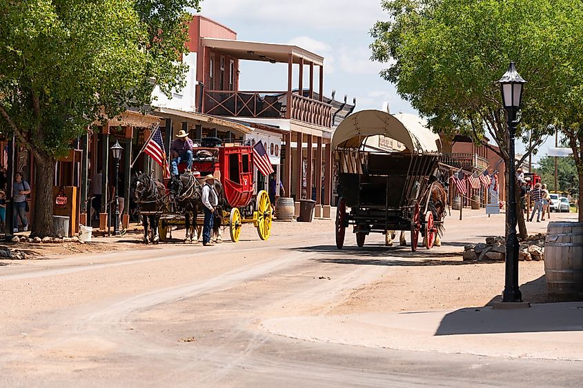 Horse-drawn coaches and wagons pull visitors around town in Tombstone, Arizona.