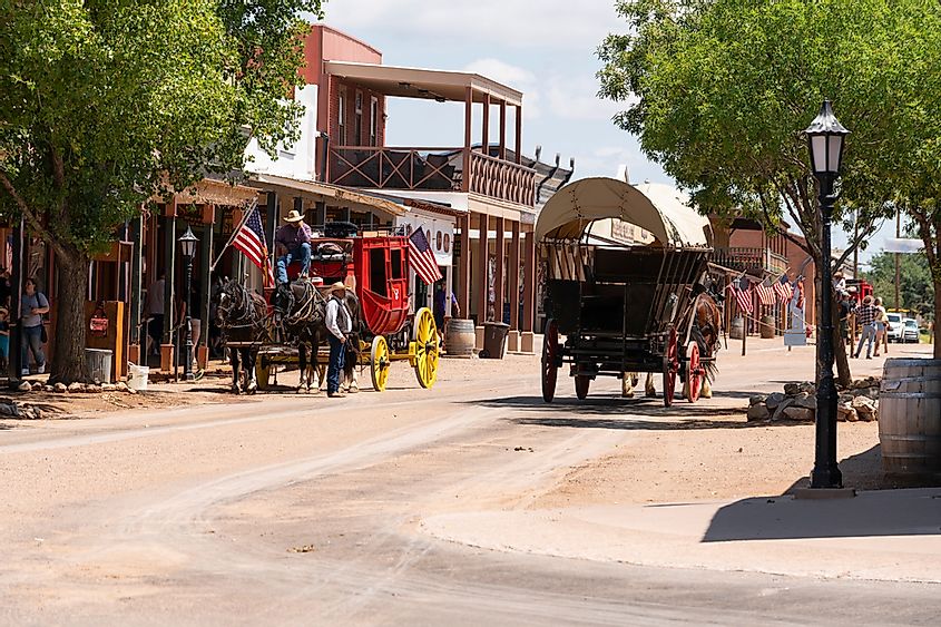 Horse Drawn Coaches and Wagons pull Visitors around Town in Tombstone, Arizona, via Real Window Creative / Shutterstock.com