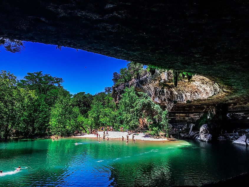 People enjoy a swim in the Hamilton Pools, Texas.