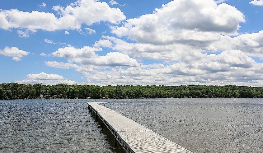 View of Conesus lake and boat dock at Long Point Beach Park. Geneseo, New York.