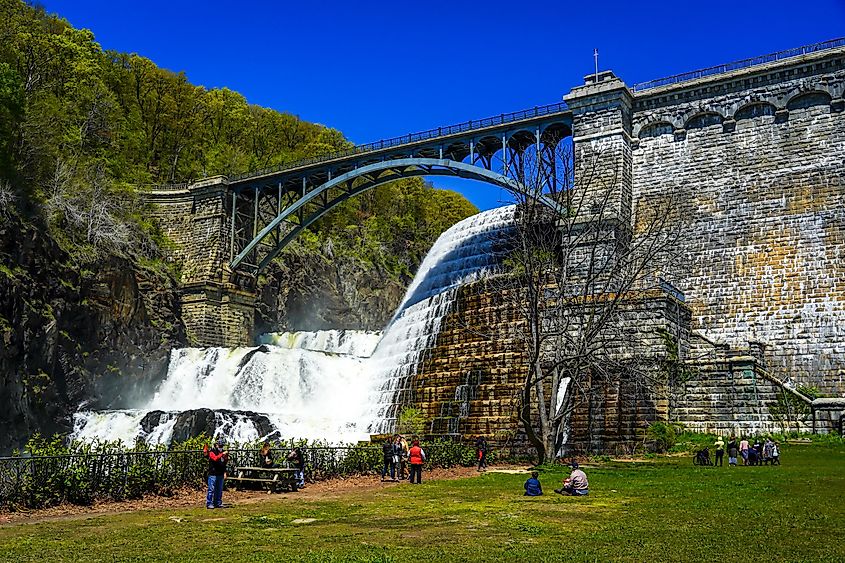 Visitors in Croton Gorge Park, watching the waterfall.