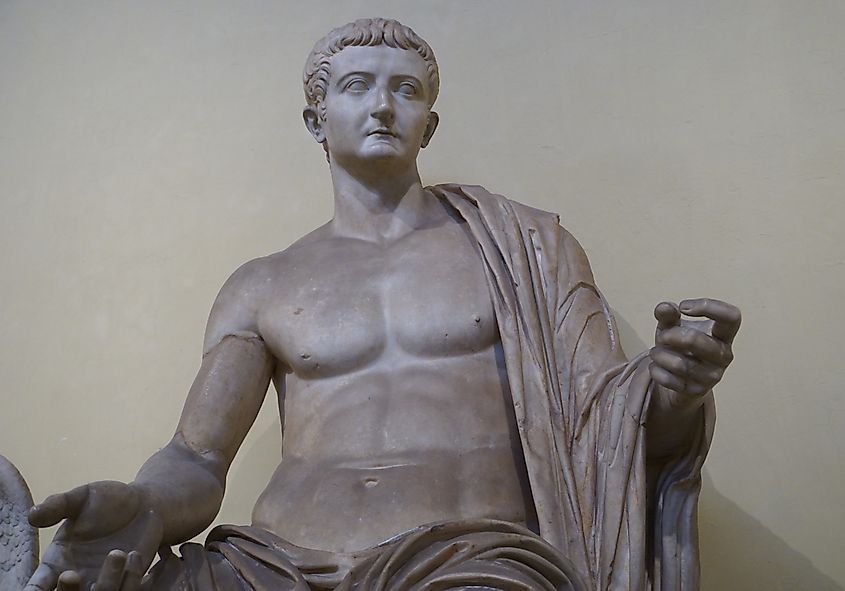Marble statue of the Roman emperor Tiberius seated in a formal pose.