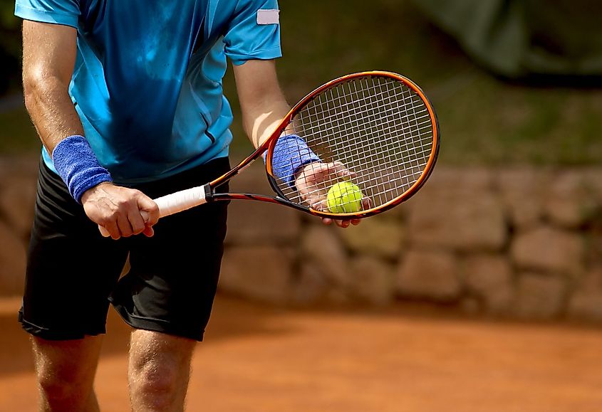 Tennis Player Prepares To Serve 