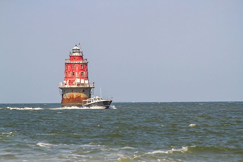 speedboat next to a lighthouse in Delaware Bay