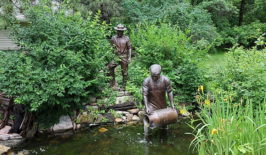 The statue of workers releasing small fish at D.C. Booth Historic National Fish Hatchery