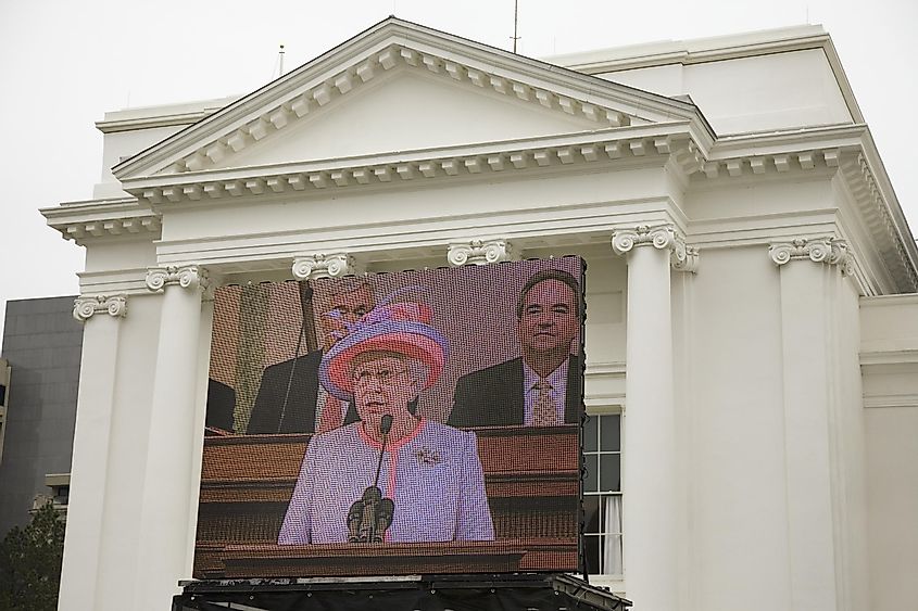 Her Majesty Queen Elizabeth II speaking on a large television monitor to the Virginia State Assembly, at the Virginia State Capitol in Richmond Virginia