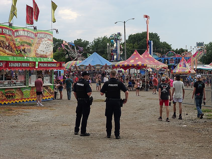 Two police officers at the Johnson County, KS Fair and Carnival.