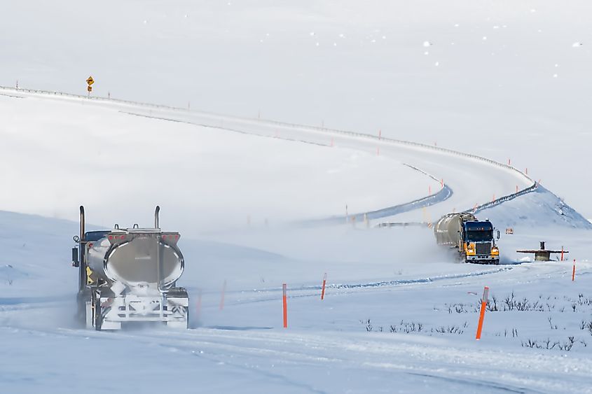 alaska's dalton highway winding up to the atigun pass in winter