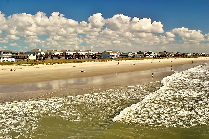 Views of the Holden Beach in NC with ocean front properties in the background