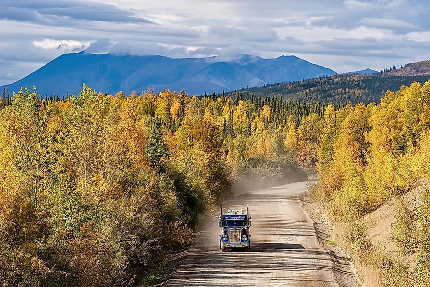 A truck travels a dusty stretch of the Dalton Highway.