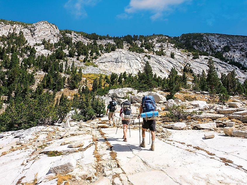 A group of backpackers hiking the John Muir Trail in the Sierra Nevada Mountains of California