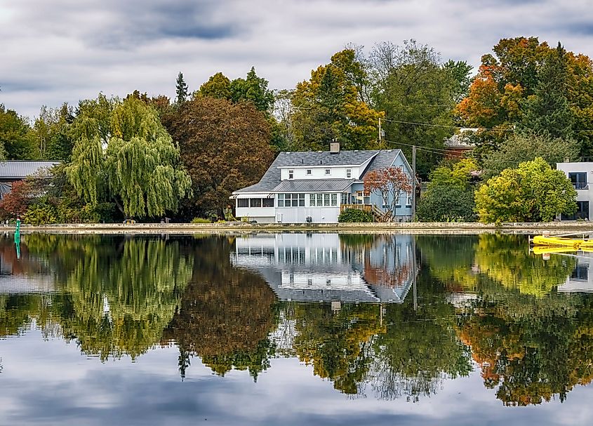 Editorial Photo Credit: Fiona M. Donnelly via Shutterstock. Reflections on the Rideau river near Merrickville, Ontario