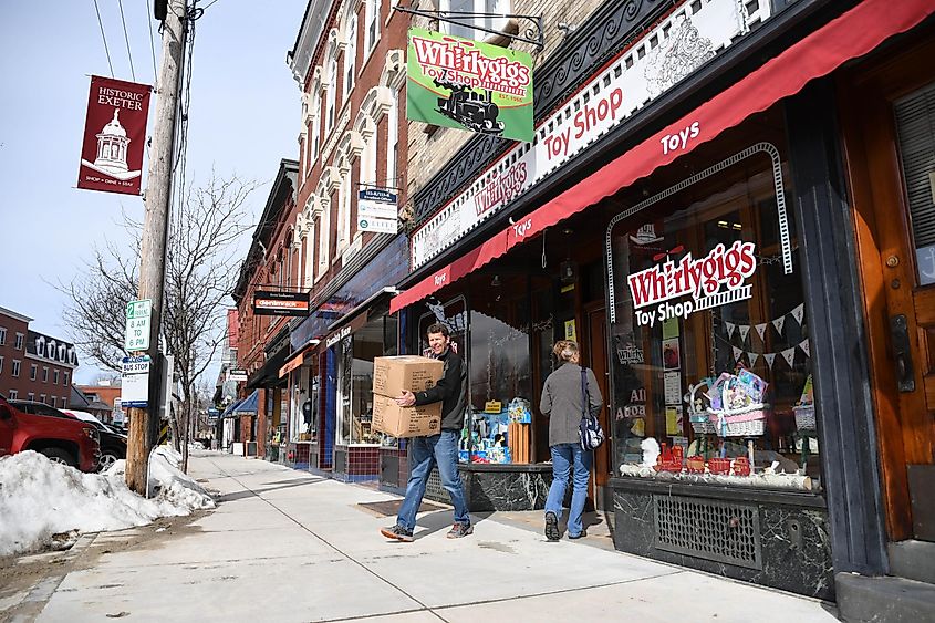 Downtown Exeter enjoys foot traffic on a cold Friday as corporate competitor Toys R Us goes out of business.