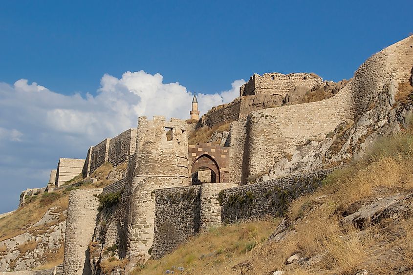 Van Fortress or Castle Of Van. castle or fortress or Citadel is a massive stone fortification built by the ancient kingdom of Urartu during the 9th to 7th centuries BC. Via Shutterstock / s bayram