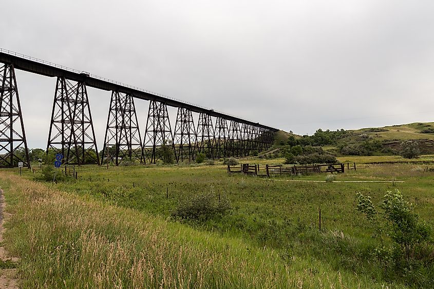 Steel truss railroad bridge west of Minot, North Dakota on a summer day.