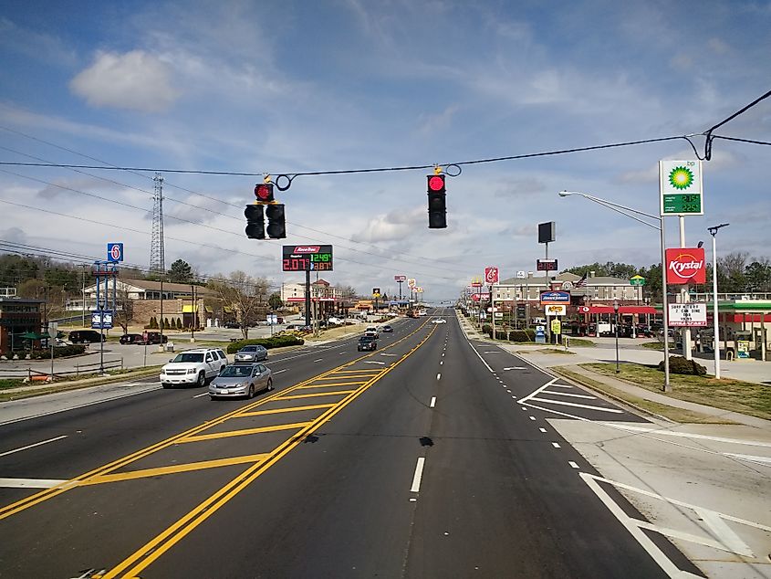 U.S. Route 441 near the interchange with I-85, north of Commerce, Georgia, with multiple lanes, highway signs, and light traffic surrounded by trees and grassy shoulders