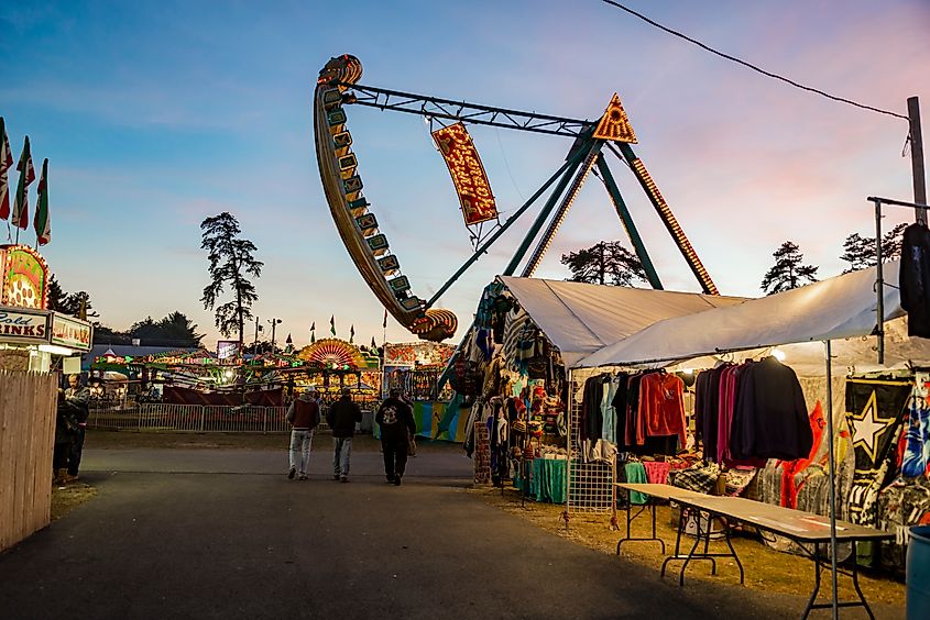 People enjoy the fair, the theme park and vendors in Fryeburg, Maine.