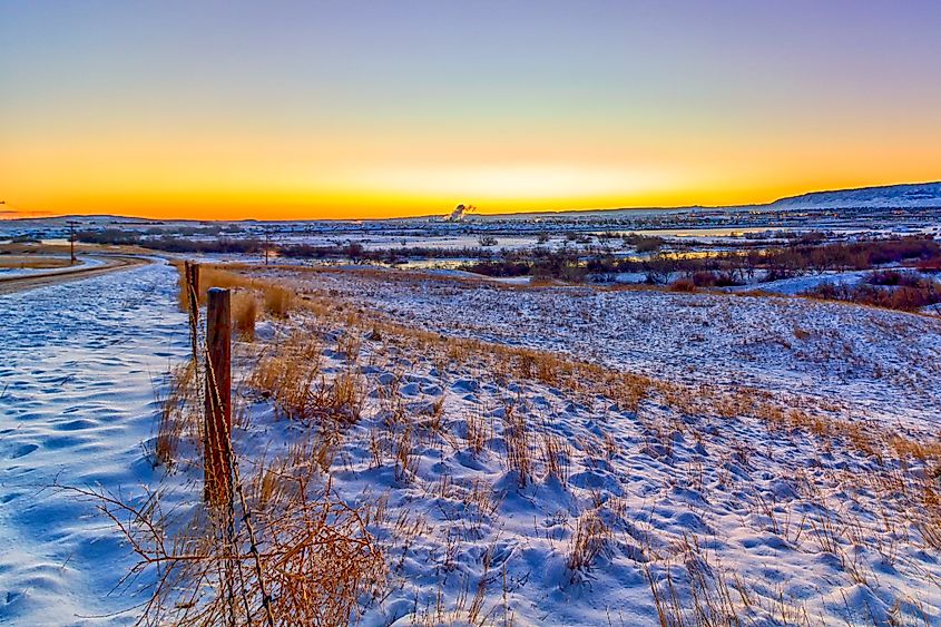 Sunrise in Casper, Wyoming, over snow-covered fields.
