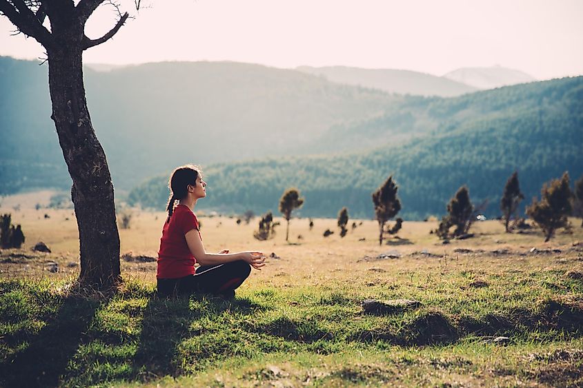 A woman meditating in nature