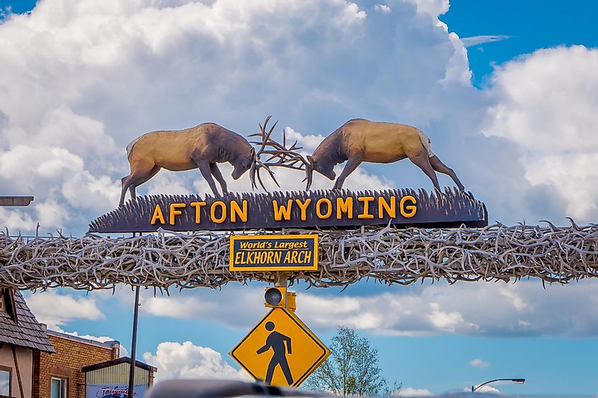 Outdoor view of the world's larges elkhorn arch at the entrance of the town in a cloudy sky background during a summer season