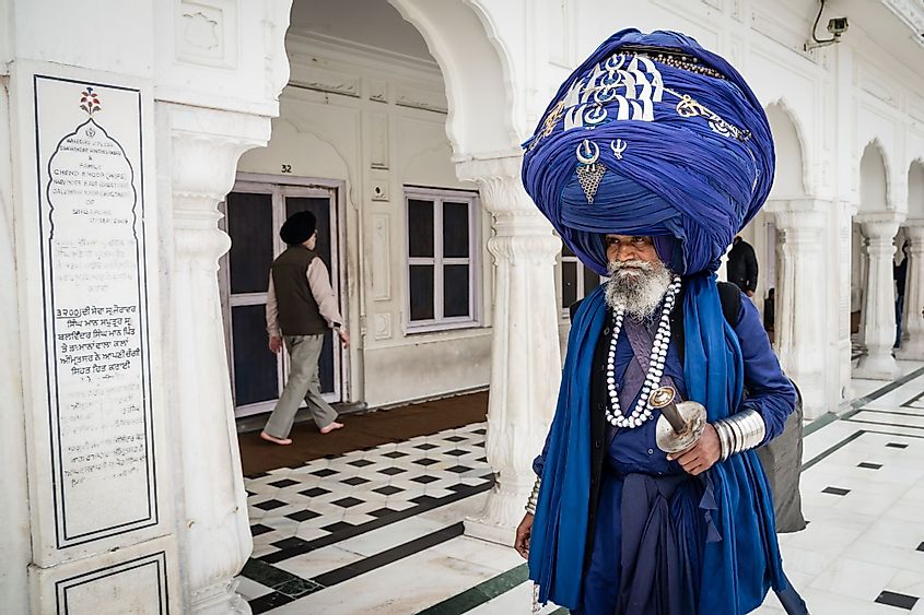 Sikh man wearing an oversized turban in Golden Temple