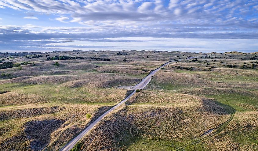 Aerial view of sandy road in Nebraska Sandhills near Seneca, spring scenery with morning light