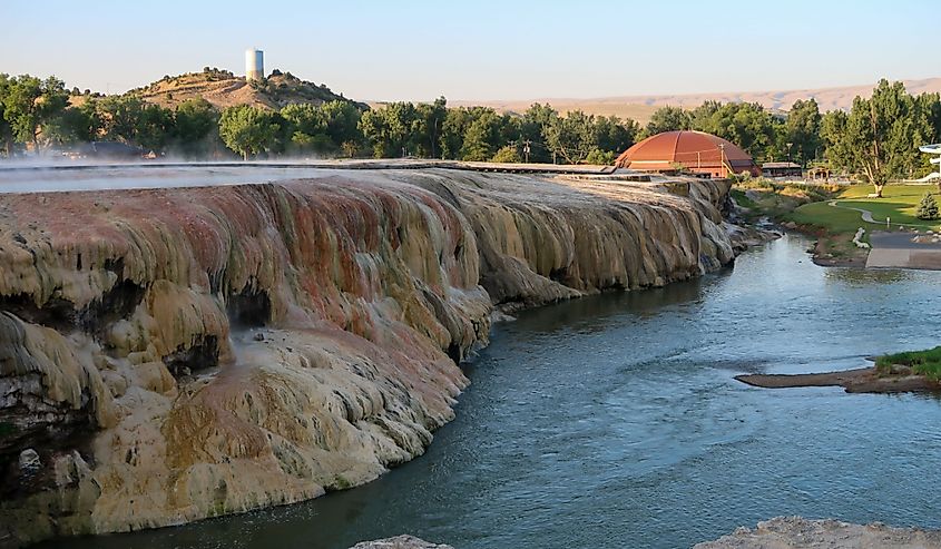 High angle landscape of a river and multi-colored travertine cliff at Hot Springs State Park in Thermopolis, Wyoming