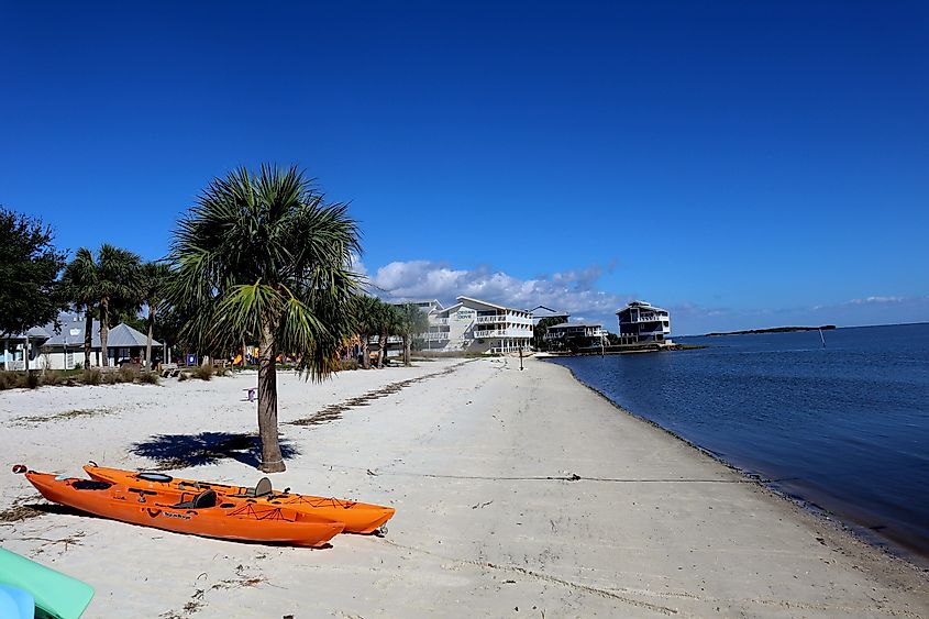Island city off the northwest coast of Florida nestled among many keys on the gulf with small town dockside shops and restaurants, via Linda White Wolf / Shutterstock.com